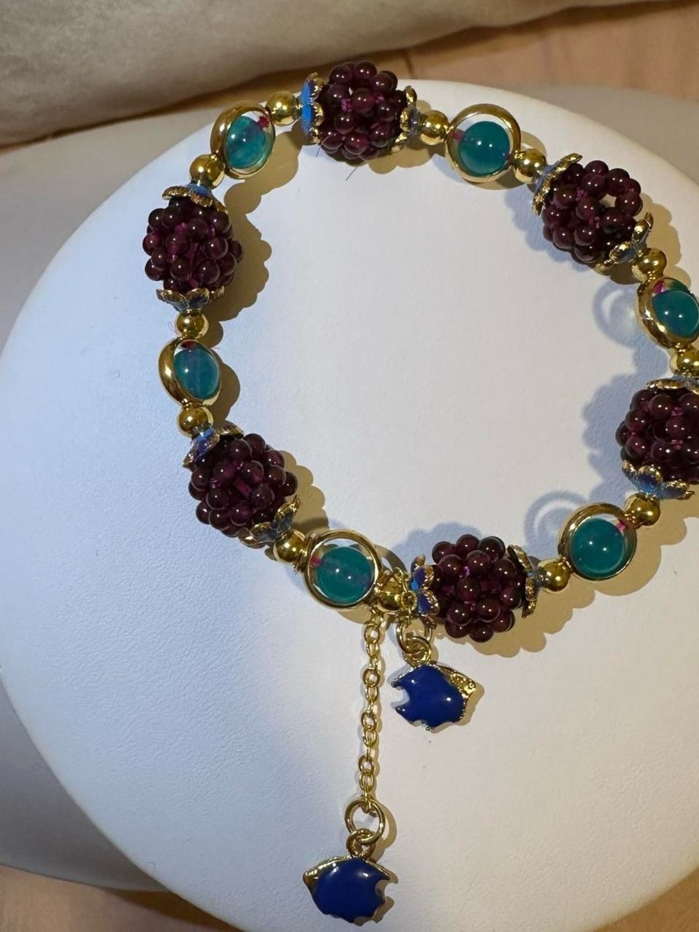 Gold tone blackberry fruit and fish bracelet